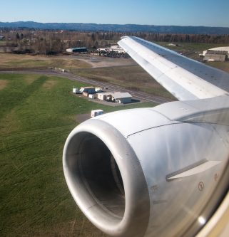 airplane engine and wing during landing at portland airport
