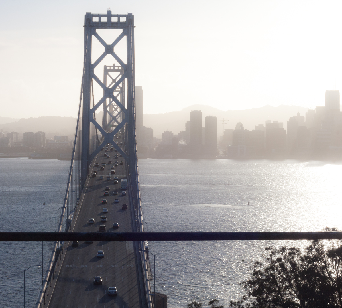 a hazy bay bridge and san francisco skyline, from treasure island