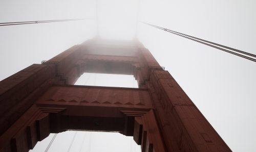 golden gate bridge tower through the fog, san francisco, california