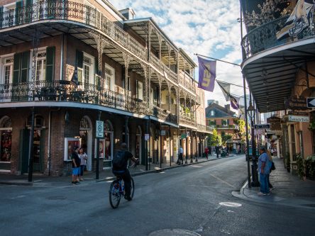bicyclist through the french quarter, new orleans, louisiana