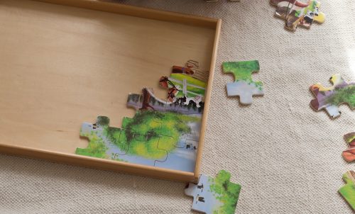 A Montessori jigsaw puzzle tray