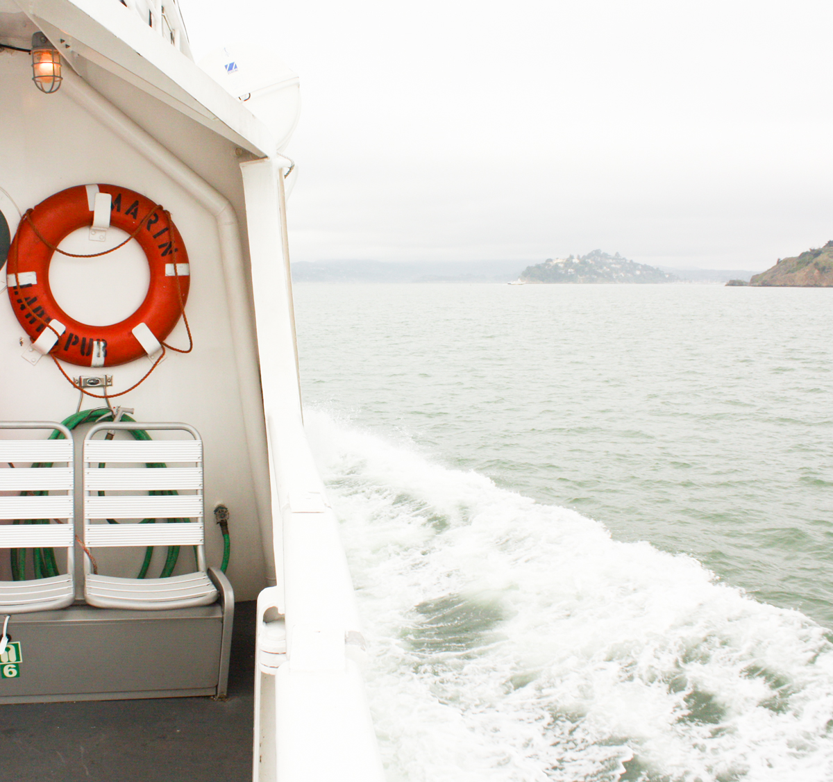 lifesaver on a boat on san francisco bay in the fog