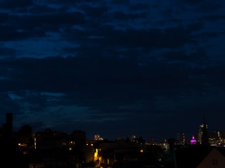 night san francisco skyline with city hall dome lit purple for prince