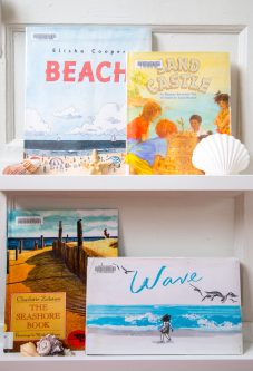 picture books about the beach, beach by elisha cooper, sand castle by brenda shannon yee, the seashore book by charlotte zolotov, and wave by suzy lee